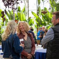 Jennifer Drake chatting with two other colleagues